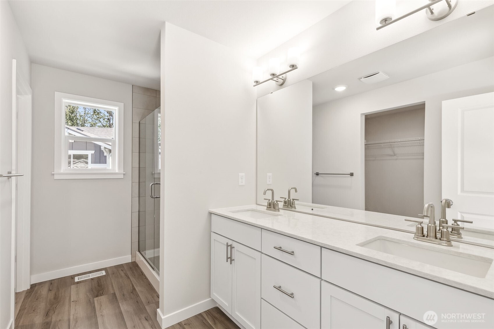 32321 134th Street Southeast Sultan, WA 98294 - Photo 24 of 27 a bathroom with a double vanity sink a mirror and a