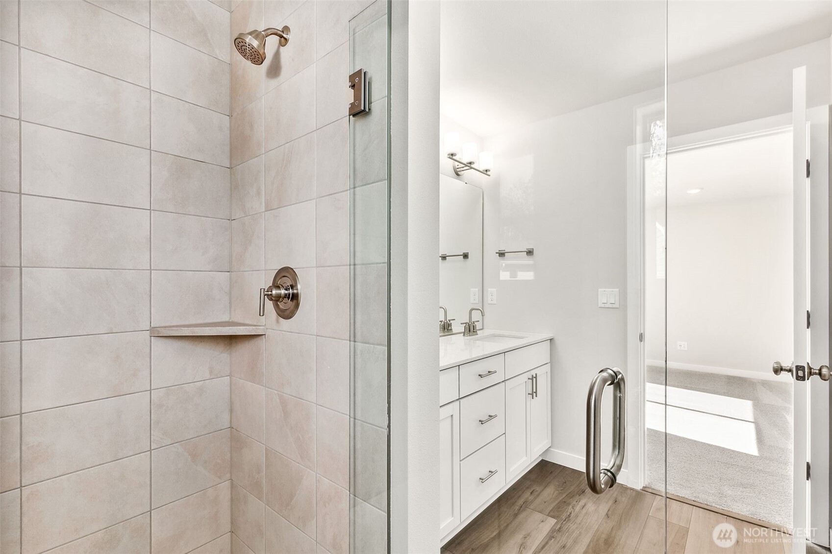 32321 134th Street Southeast Sultan, WA 98294 - Photo 26 of 27 a spacious bathroom with a double vanity sink a mirror and shower
