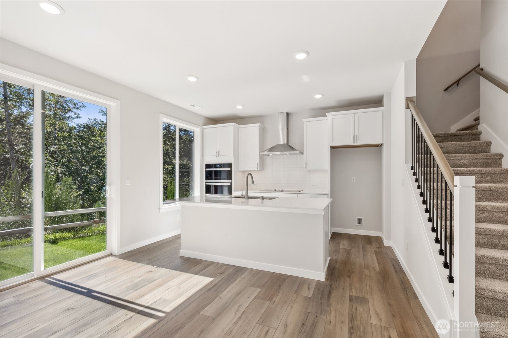 32321 134th Street Southeast Sultan, WA 98294 - Photo 4 of 27 a kitchen with wooden floor and window
