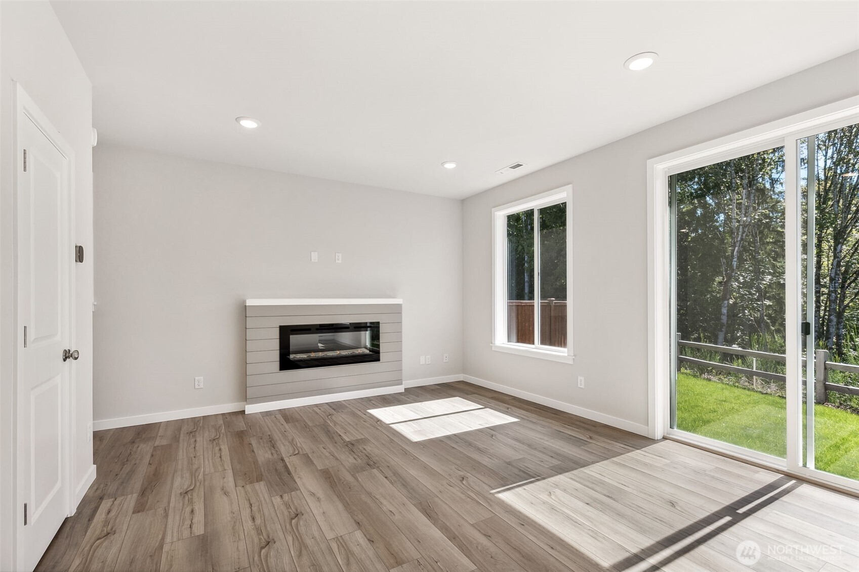 32321 134th Street Southeast Sultan, WA 98294 - Photo 10 of 27 a view of an empty room with glass door and windows