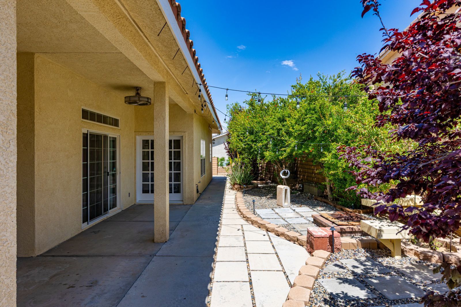 107 Brianna Street Ridgecrest, CA 93555 - Photo 48 of 50 a view of a patio with table and chairs and potted plants