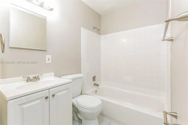 a bathroom with a sink a toilet and a bathtub