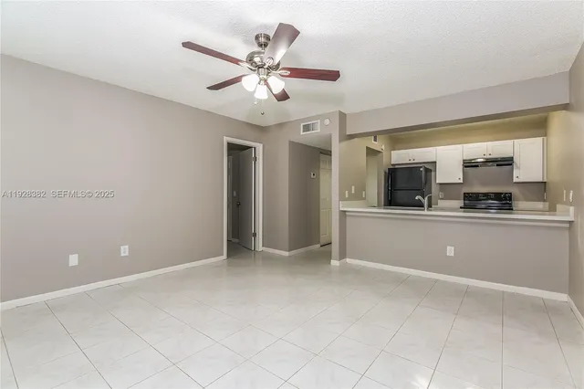 a view of a kitchen with a sink and dishwasher cabinets