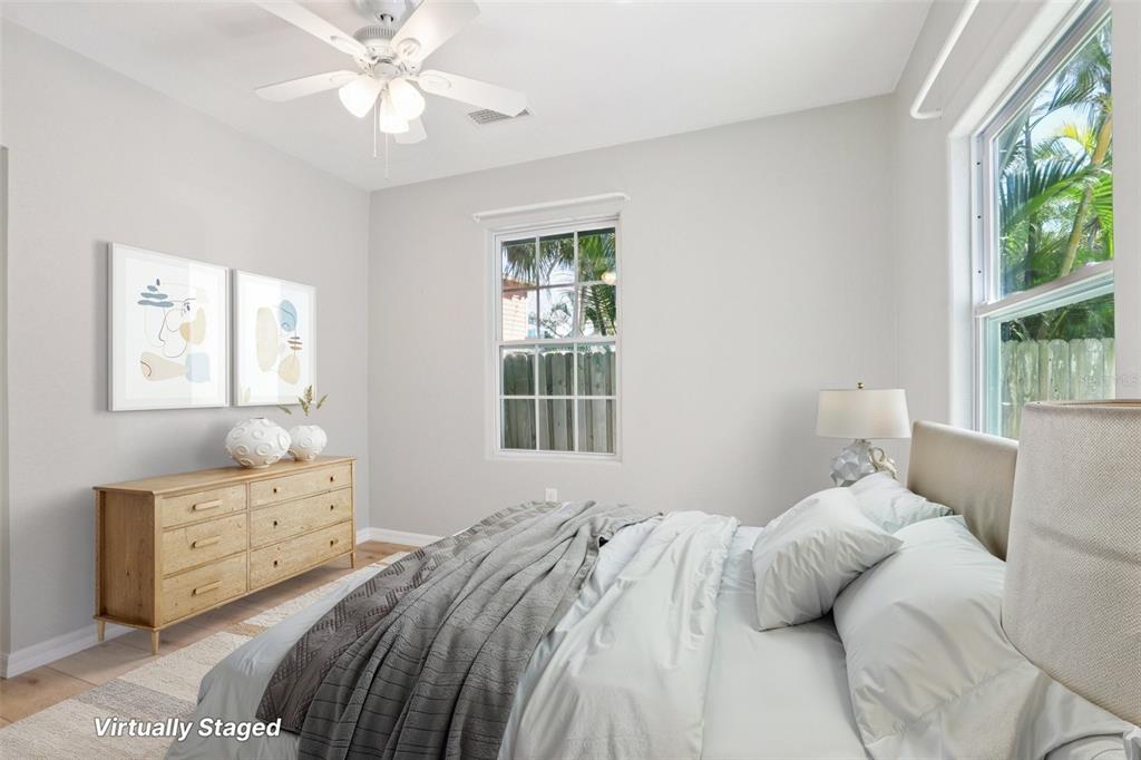 13135 4th Street East Madeira Beach, FL 33708 - Photo 12 of 24 a bedroom with a bed and a window