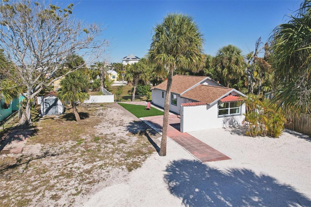 13135 4th Street East Madeira Beach, FL 33708 - Photo 18 of 24 a view of a house with a yard