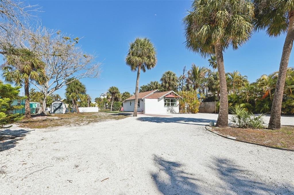 13135 4th Street East Madeira Beach, FL 33708 - Photo 19 of 24 a view of a house with a yard and garage