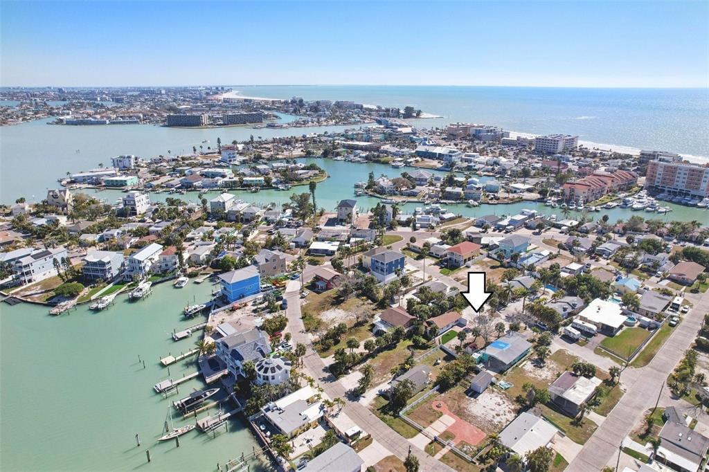 13135 4th Street East Madeira Beach, FL 33708 - Photo 21 of 24 an aerial view of a city with ocean view in back