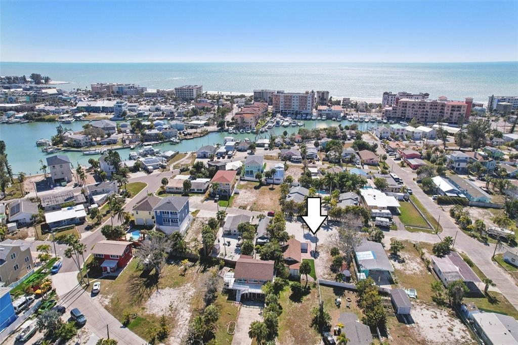 13135 4th Street East Madeira Beach, FL 33708 - Photo 22 of 24 an aerial view of a city with lots of residential buildings