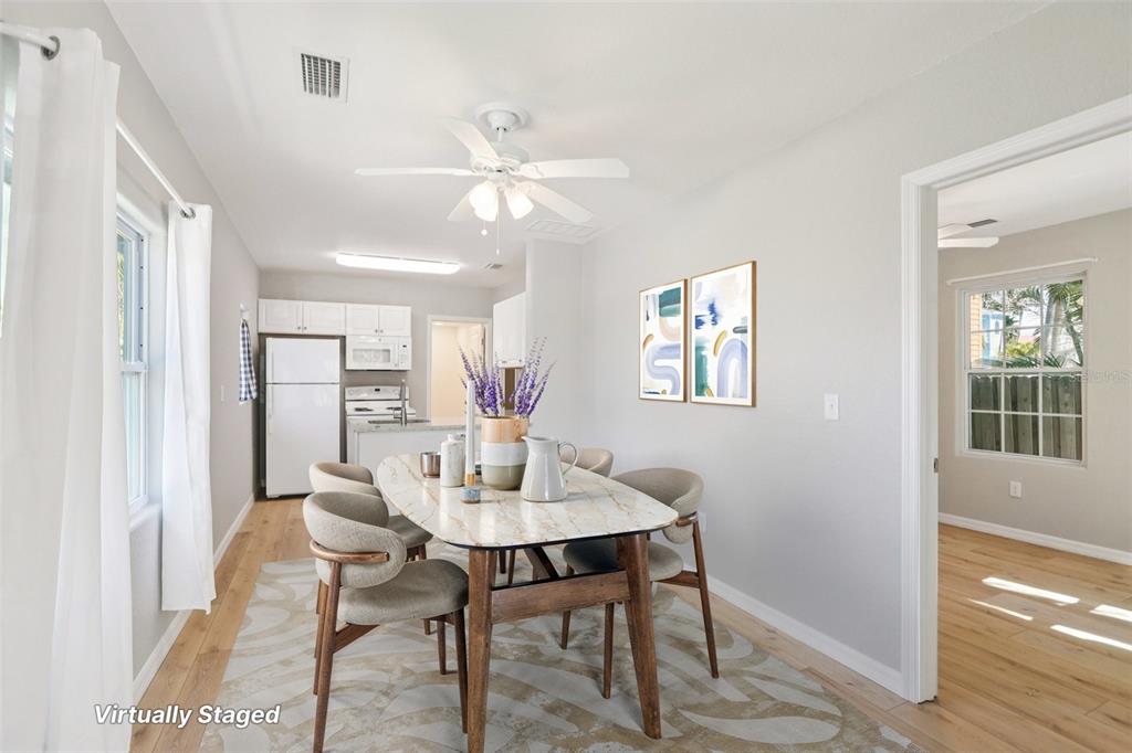 13135 4th Street East Madeira Beach, FL 33708 - Photo 9 of 24 a view of a dining room with furniture and chandelier