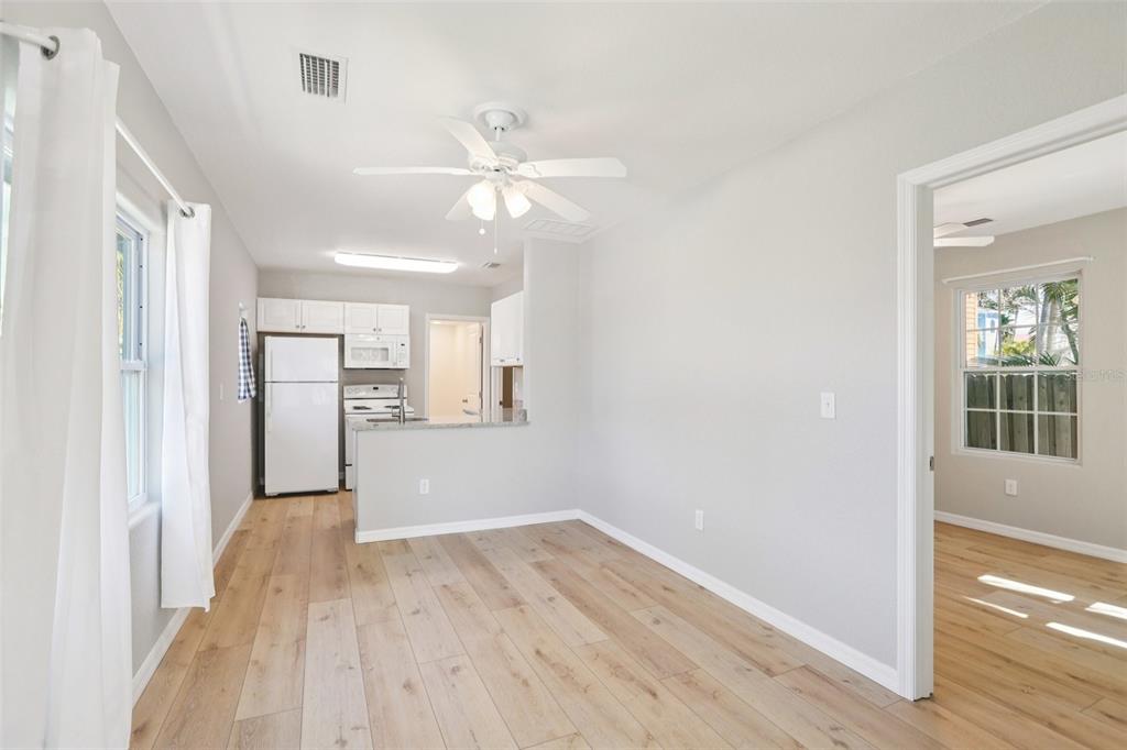 13135 4th Street East Madeira Beach, FL 33708 - Photo 10 of 24 a view of empty room with wooden floor and fan
