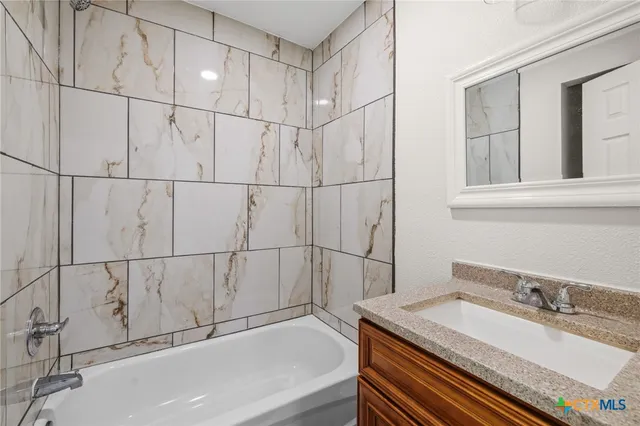 a bathroom with a sink and a bathtub