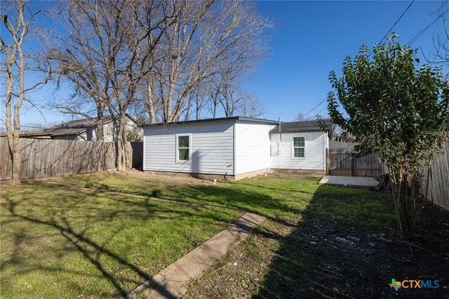 a view of backyard of house