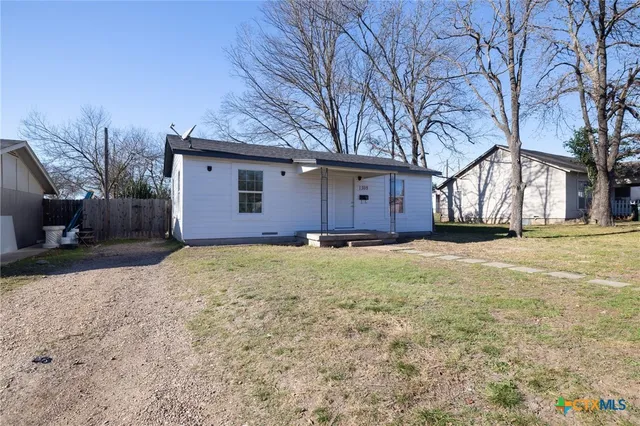 a house with trees in front of it