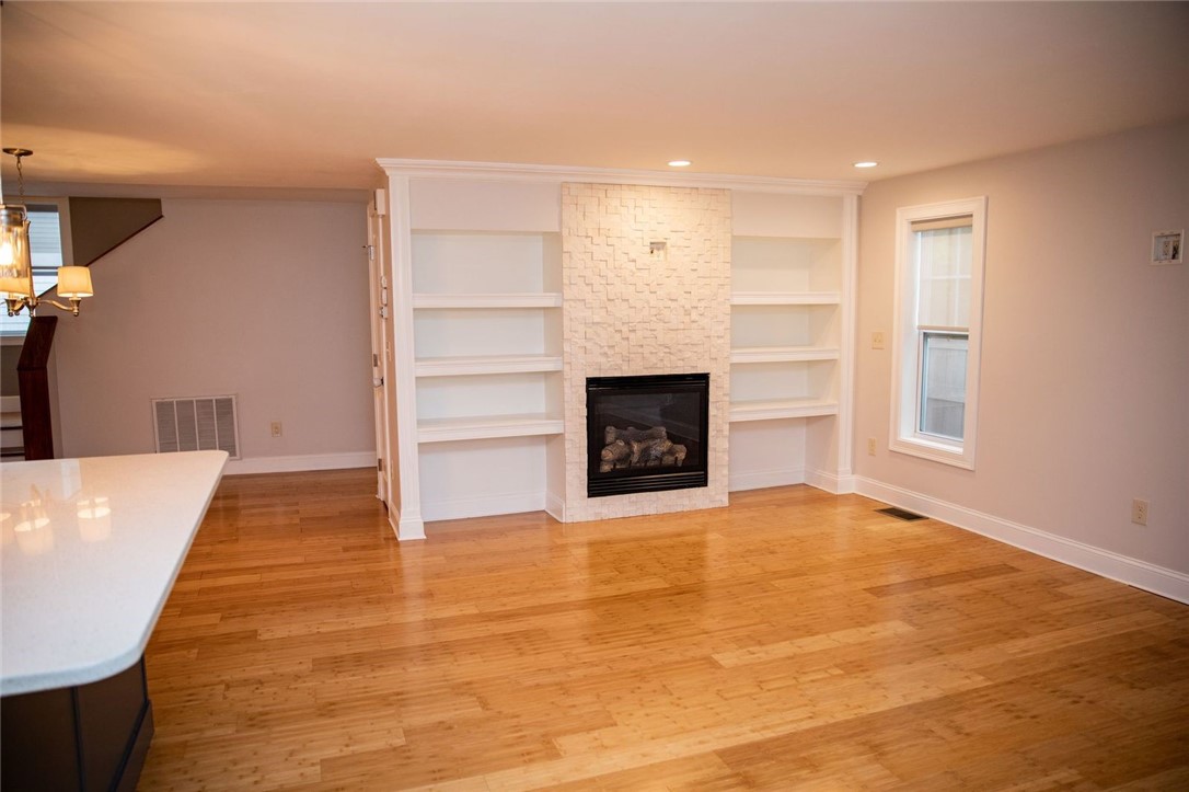 11 Nobert Street, Unit B Warren, RI 02885 - Photo 6 of 22 Fireplace w/ built-in shelves