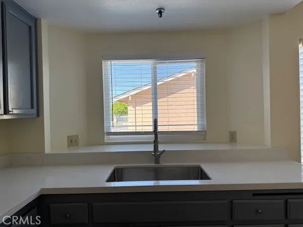 a kitchen that has a sink and a stove