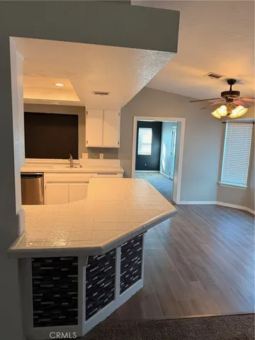 a room with a bed and a flat screen tv