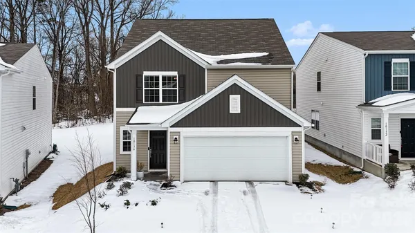a front view of a house with yard