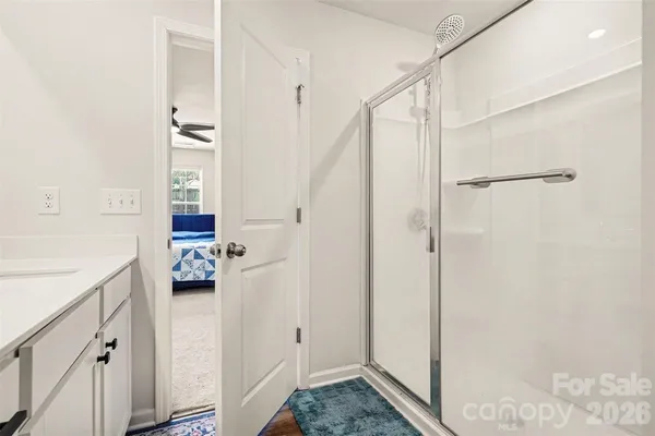 a bathroom with a sink and shower