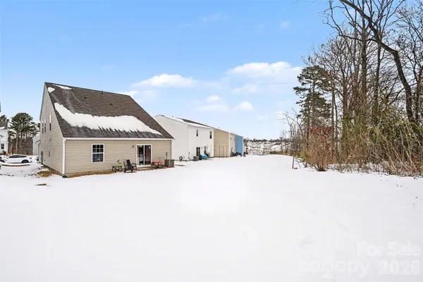 a big house with a large tree in front of it