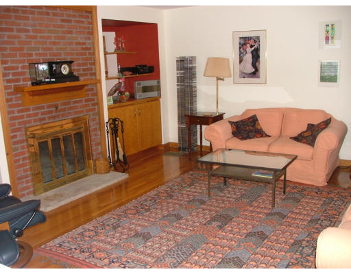 10 Cozy Street, Unit 10 Watertown, MA 02472 - Photo 3 of 11 a living room with furniture and a fireplace