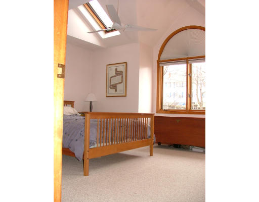 10 Cozy Street, Unit 10 Watertown, MA 02472 - Photo 7 of 11 a bedroom with a bed and a window