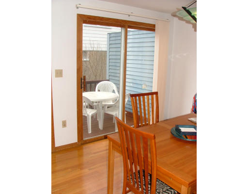 10 Cozy Street, Unit 10 Watertown, MA 02472 - Photo 8 of 11 a view of a living room with a floor to ceiling window