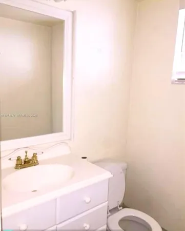 a bathroom with a sink and a toilet