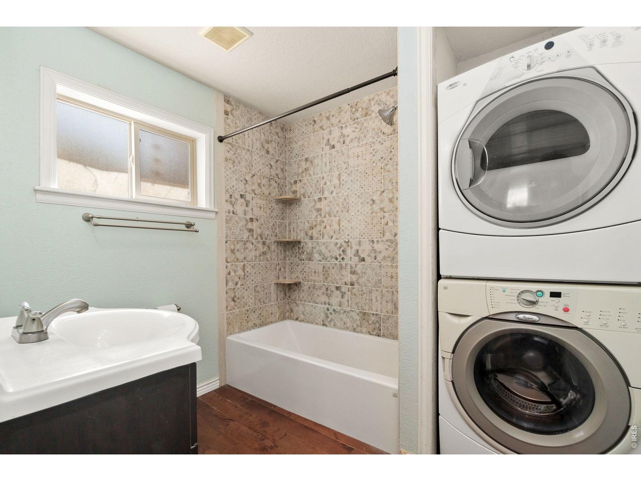 245 6th Street Frederick, CO 80530 - Photo 13 of 17 a bathroom with a sink a washer and dryer