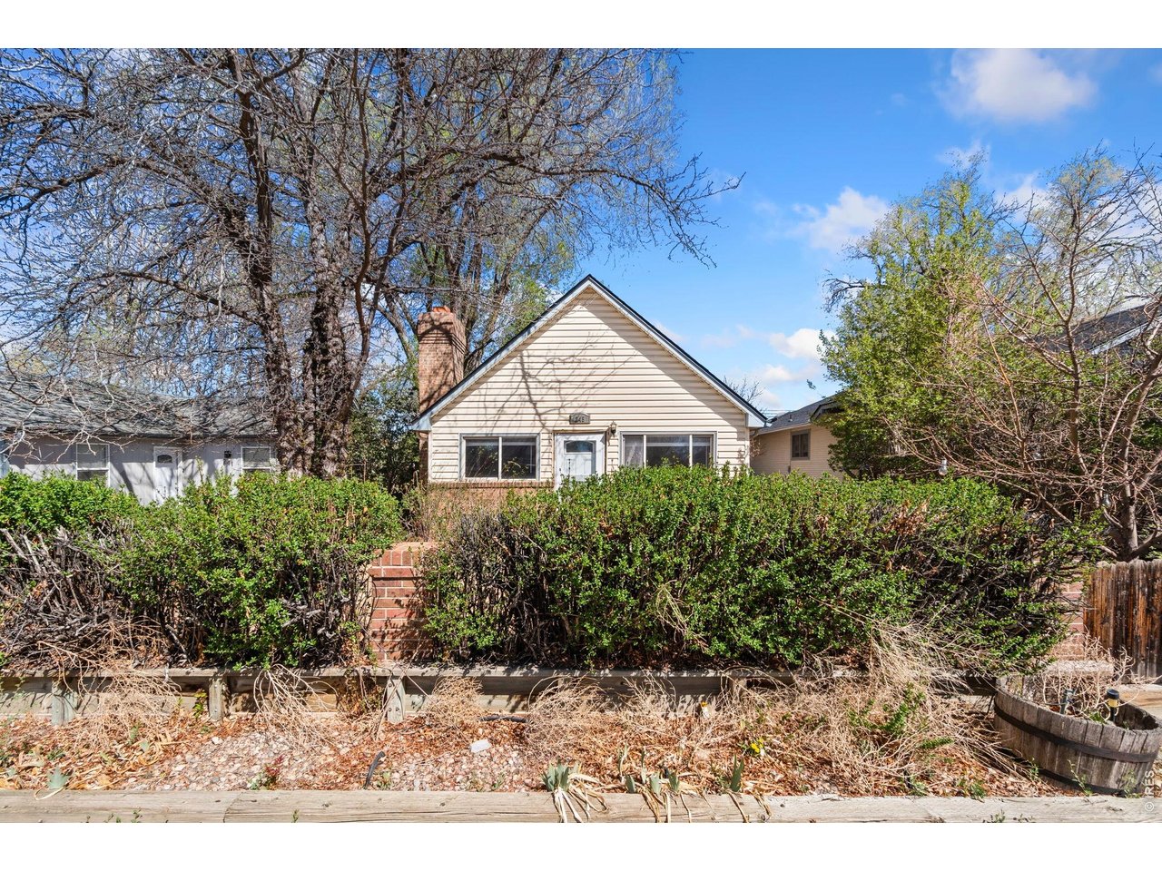 245 6th Street Frederick, CO 80530 - Photo 2 of 17 a view of house with a yard and potted plants