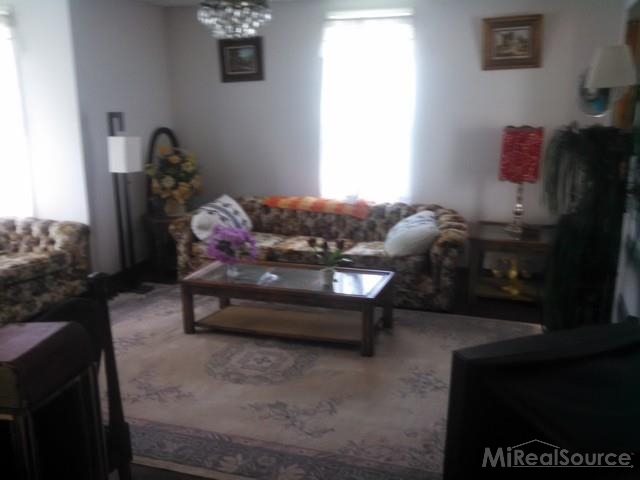 7663 Avoca Road Avoca, MI 48006 - Photo 4 of 23 This is a view of the living room.