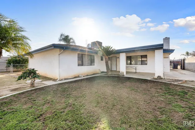 a house with trees in the background