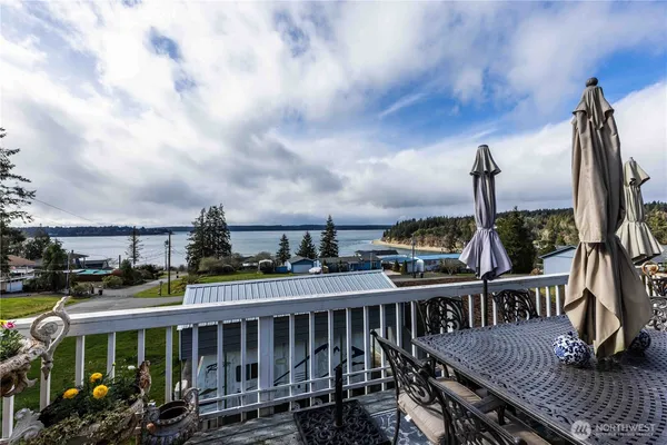 a view of a balcony with chairs