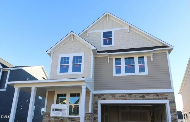 a front view of a house with glass windows