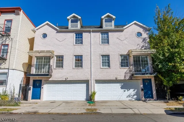 a front view of a building with parking