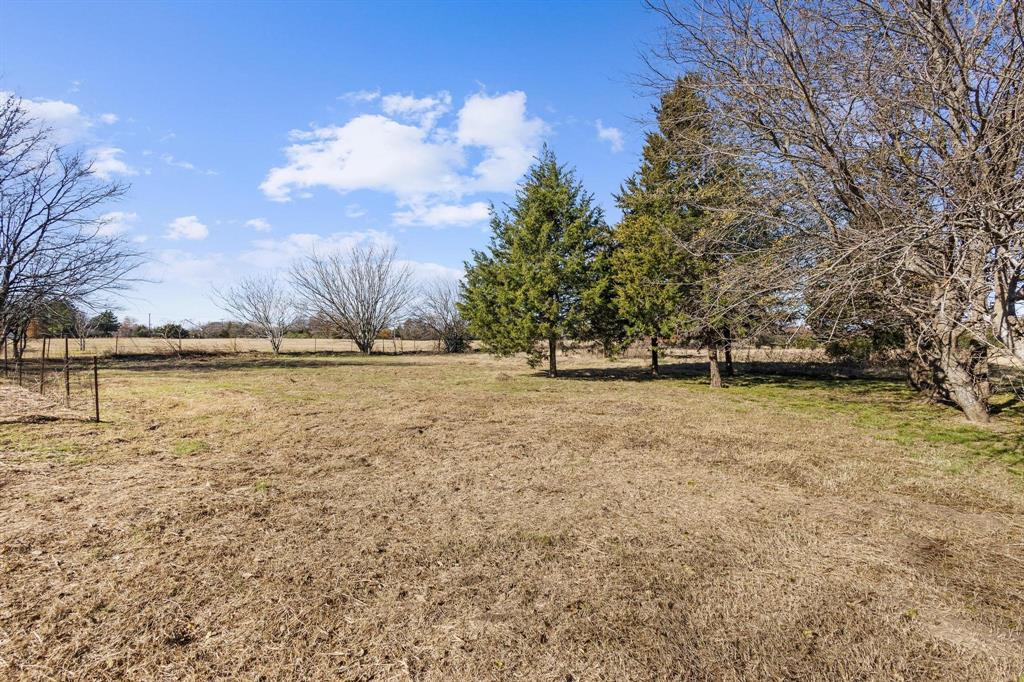 3467 East Fm 120 Denison, TX 75021 - Photo 12 of 38 a view of outdoor space with swimming pool and green space