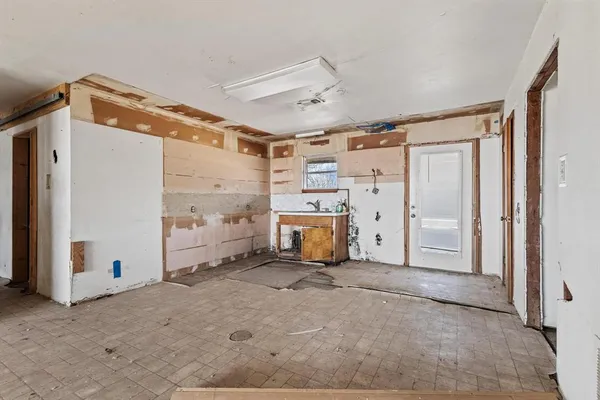 a living room with furniture and next to a window