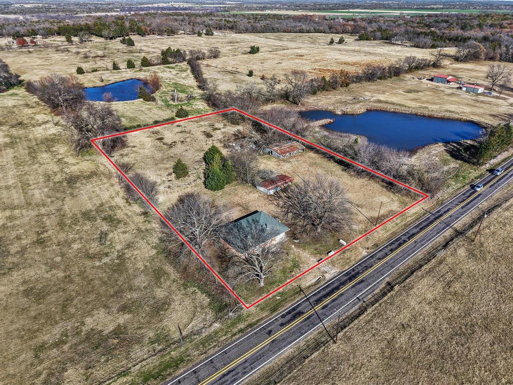 3467 East Fm 120 Denison, TX 75021 - Photo 33 of 38 a view of a backyard with wooden floor
