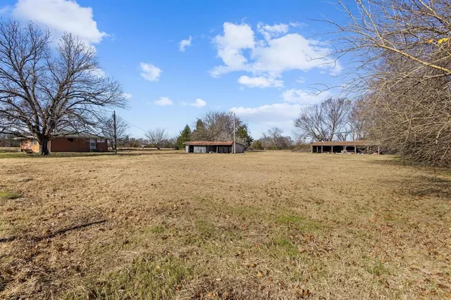 a house with trees in the background