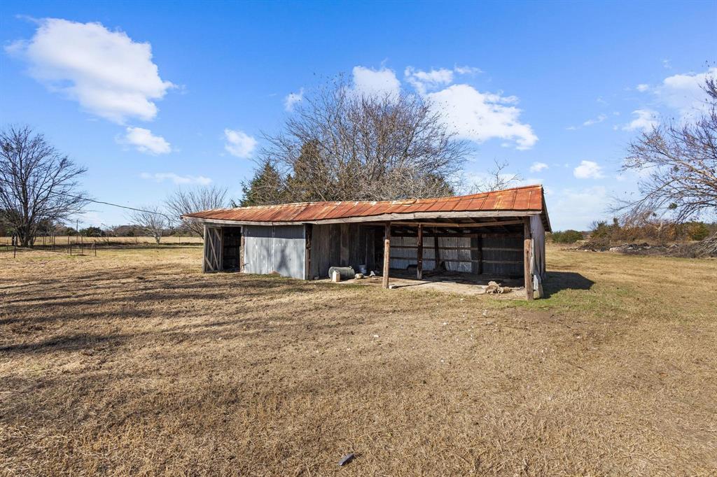 3467 East Fm 120 Denison, TX 75021 - Photo 7 of 38 a house with trees in the background