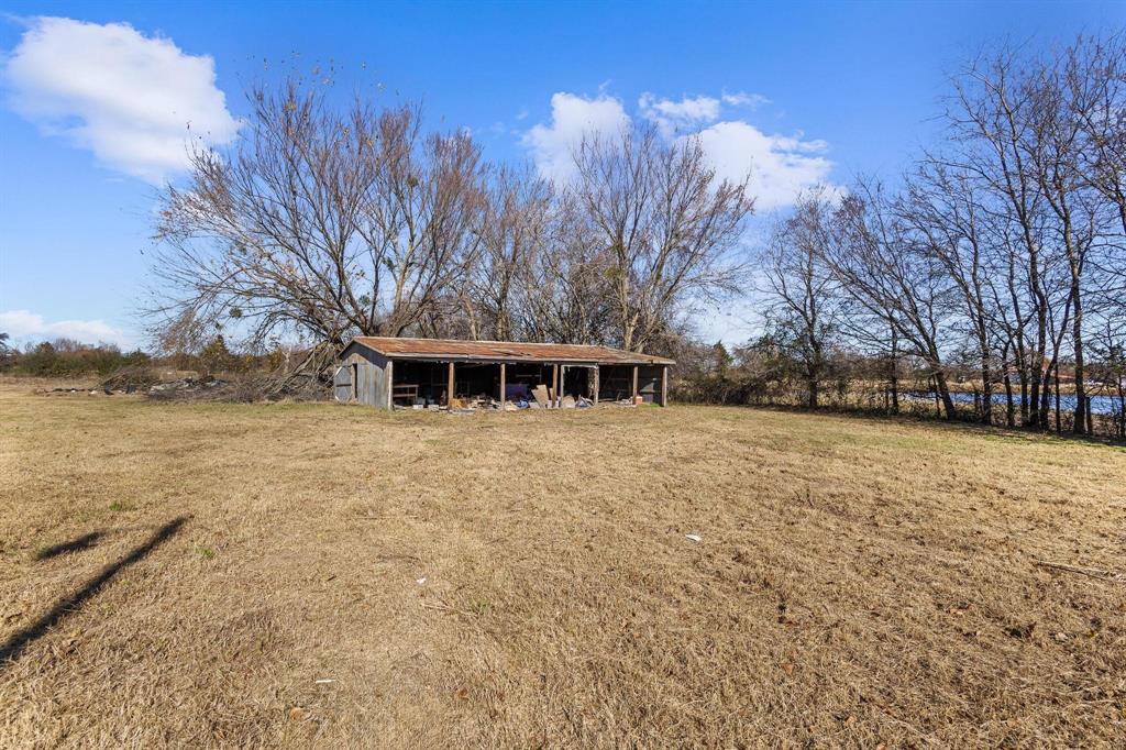 3467 East Fm 120 Denison, TX 75021 - Photo 8 of 38 a front view of a house with a yard and covered with snow
