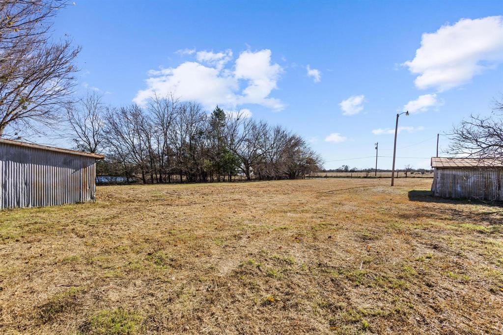 3467 East Fm 120 Denison, TX 75021 - Photo 9 of 38 a view of yard covered with snow in front of house