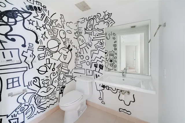 a bathroom with a toilet and a sink