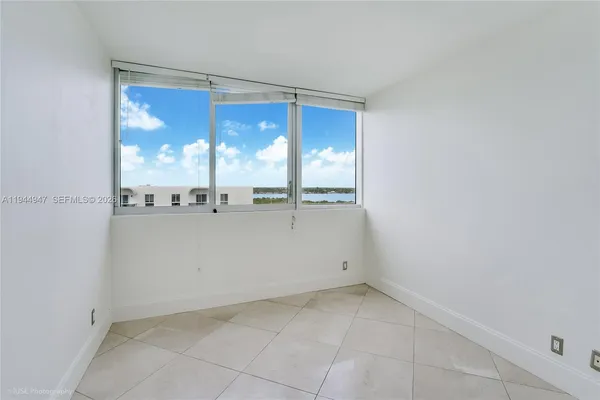 an empty room with a large window
