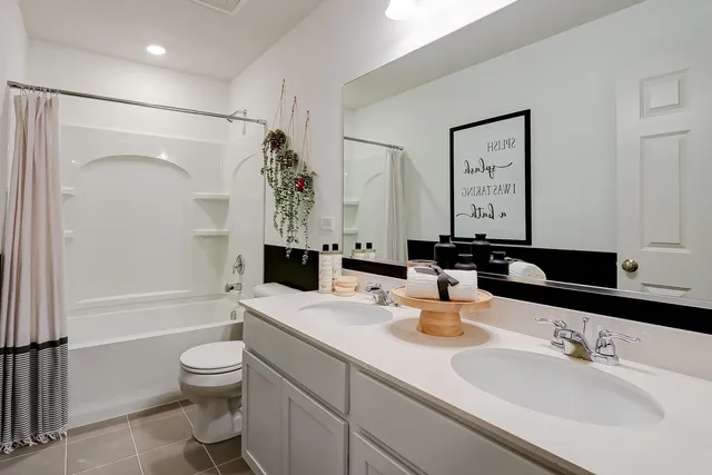 a bathroom with a bathtub and a window