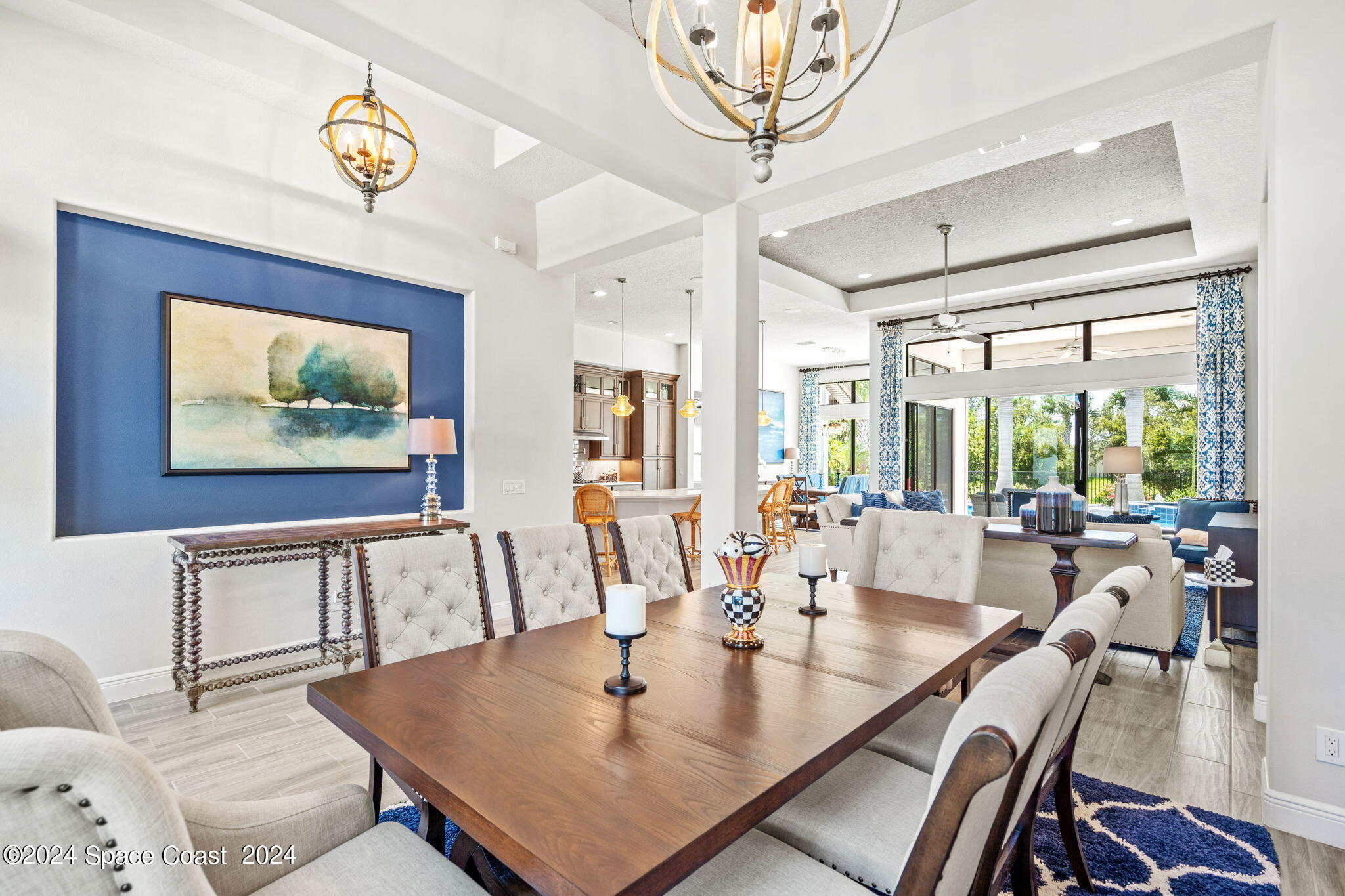 5187 Kirkwall Circle Melbourne, FL 32940 - Photo 16 of 53 a view of a dining room with furniture a chandelier and wooden floor
