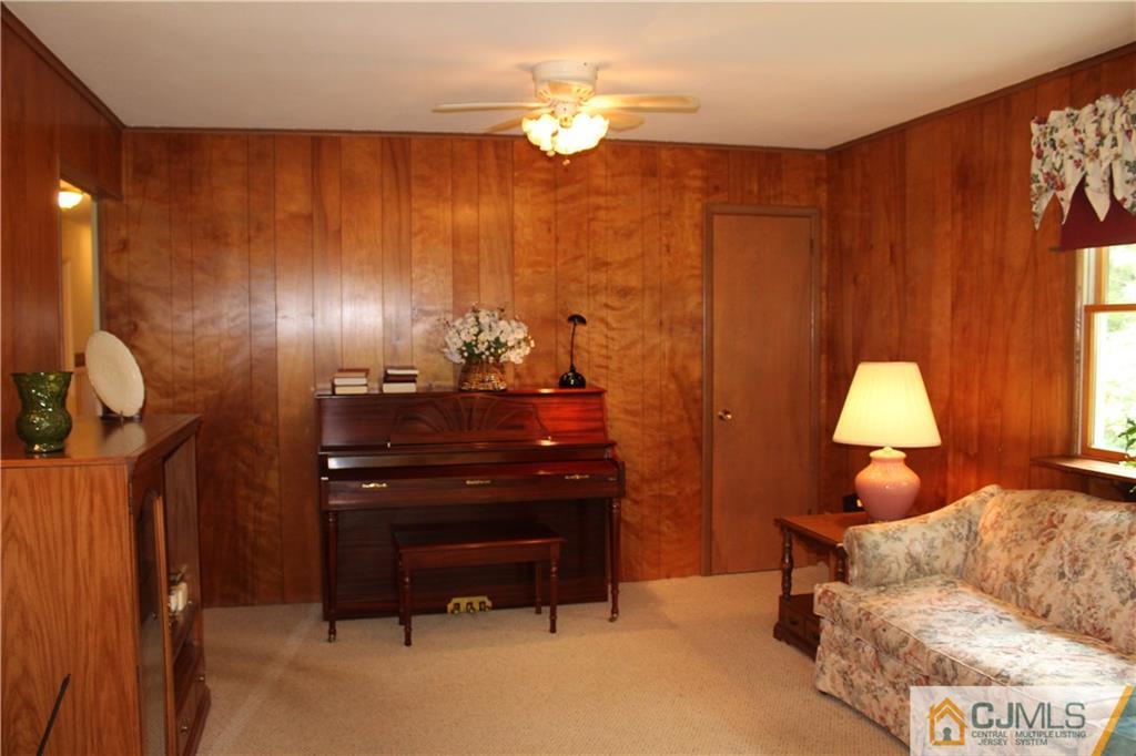 98 Colonia Road Colonia, NJ 07067 - Photo 14 of 21 a living room with furniture and a lamp