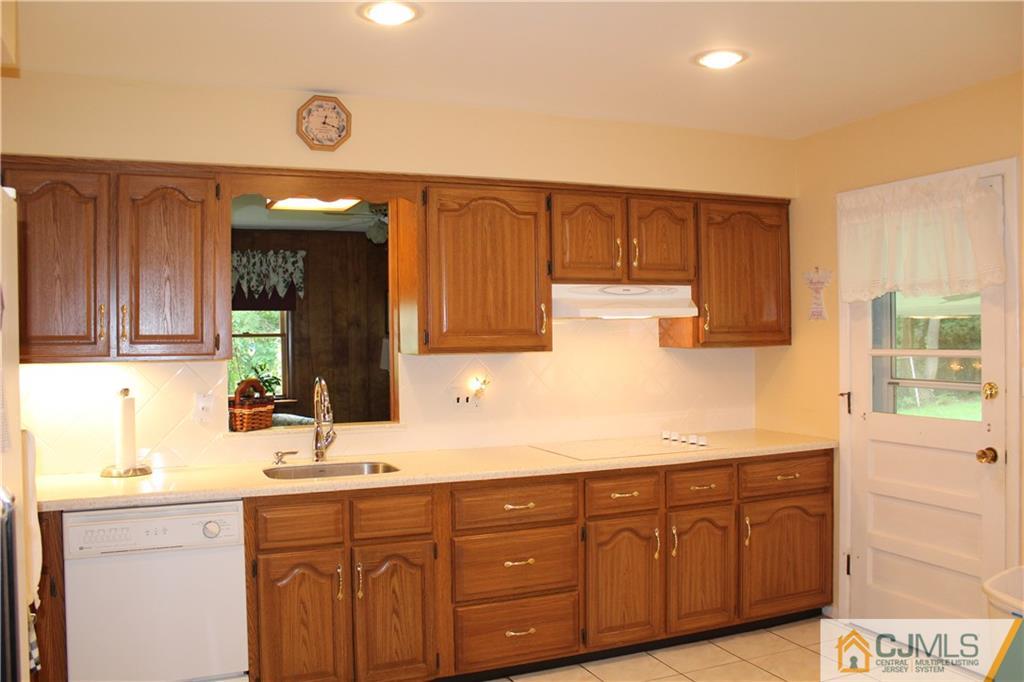 98 Colonia Road Colonia, NJ 07067 - Photo 8 of 21 a bathroom with a sink and a mirror