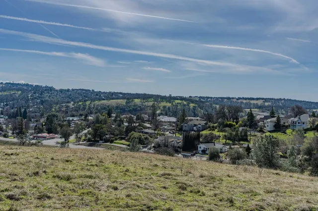 a view of a large mountain with mountains in the background