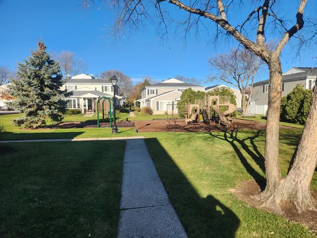 a view of swimming pool with outdoor seating and yard