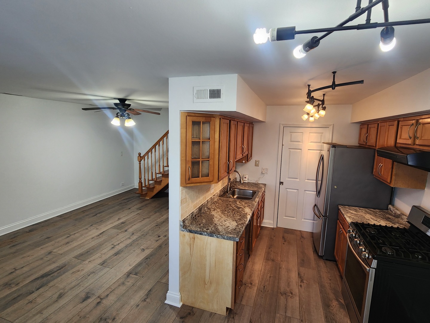 1597 Cove Drive, Unit 185C Prospect Heights, IL 60070 - Photo 3 of 12 a view of a livingroom with furniture and wooden floor